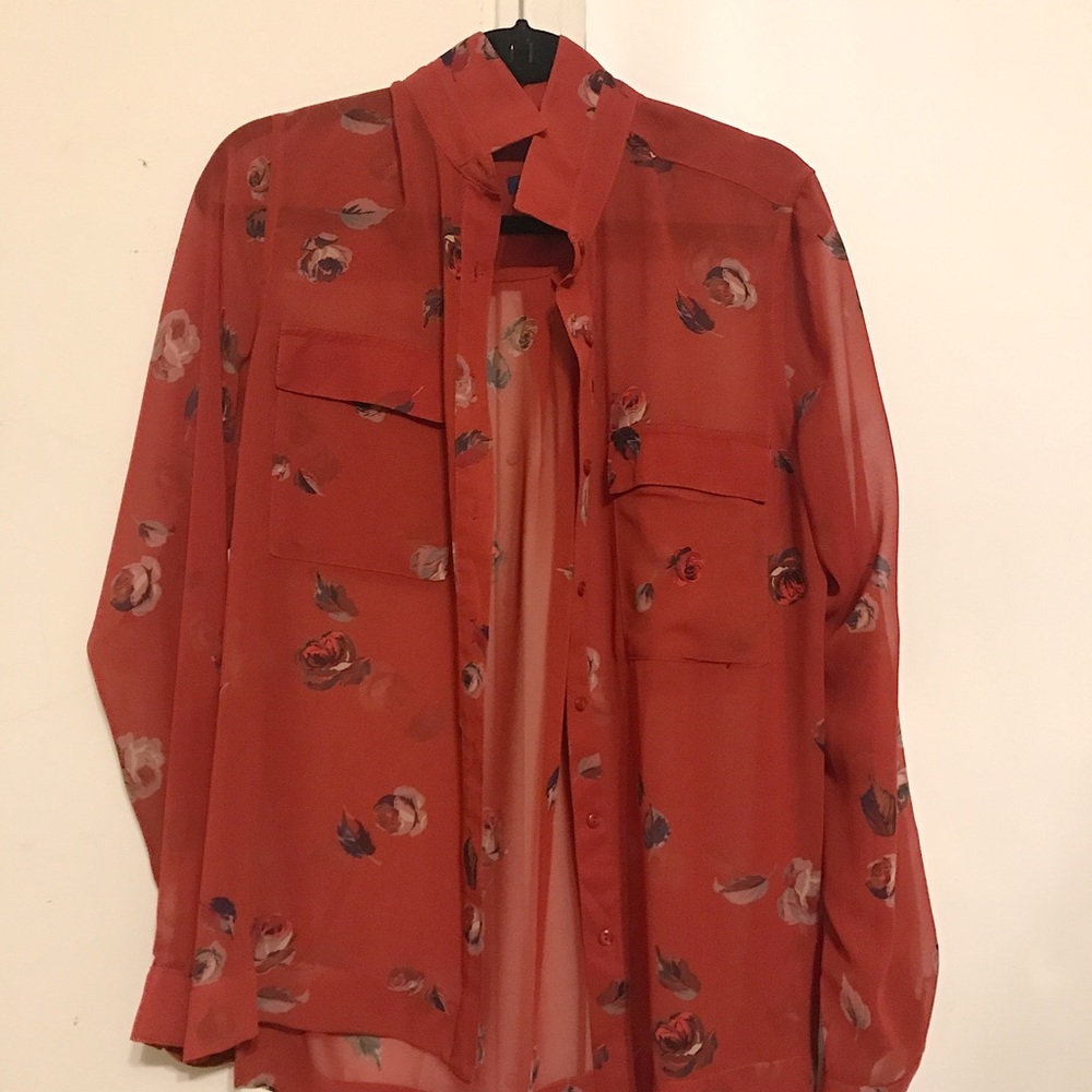 Sheer red blouse with roses